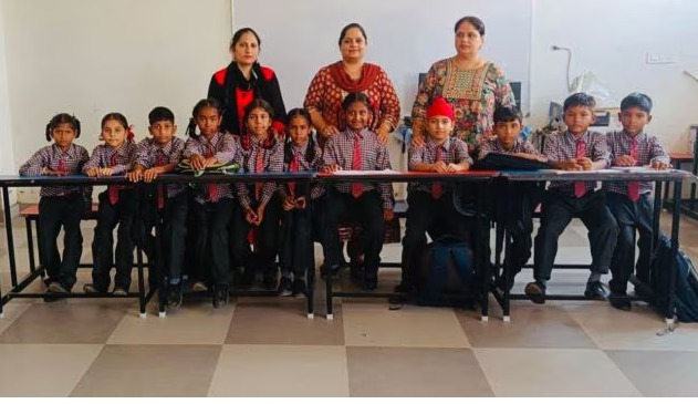 "Children walking to school in flood-affected area with damaged houses in background"